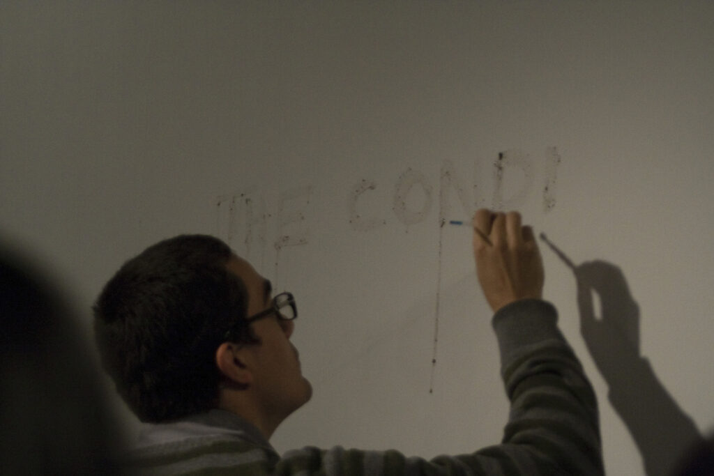 Julian Higuerey Núñez presenting the conditions of surrender at XPACE Cultural Centre