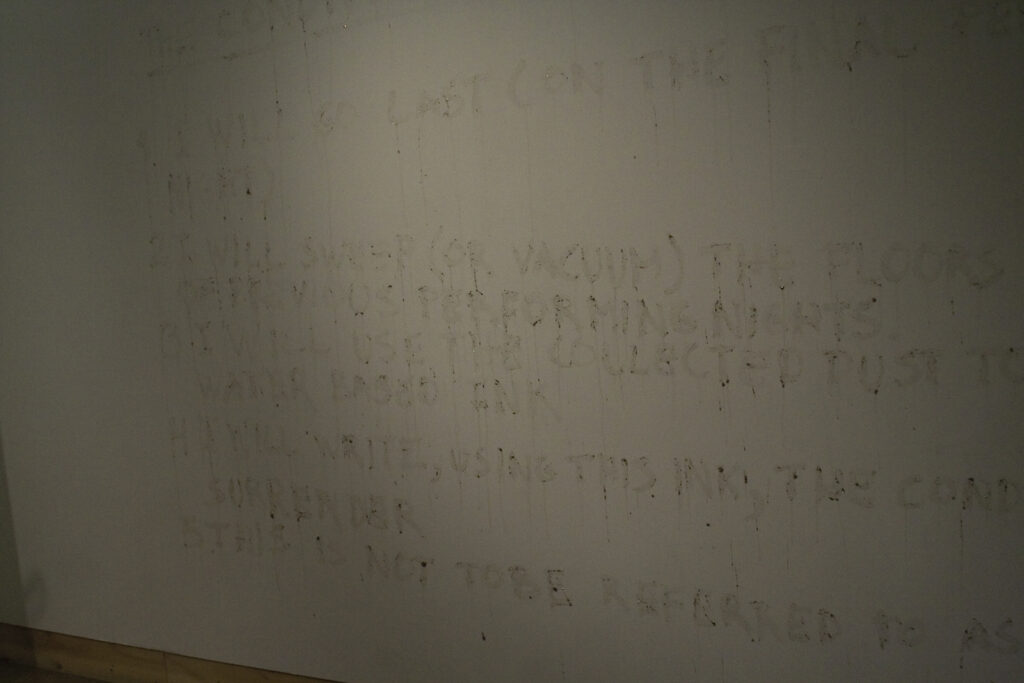 Julian Higuerey Núñez presenting the conditions of surrender at XPACE Cultural Centre