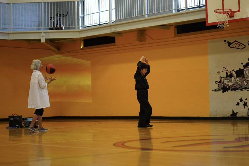 Sakiko Yamaoka and audience participant perform Body Maintenance as part of KinesTHESES, 2019