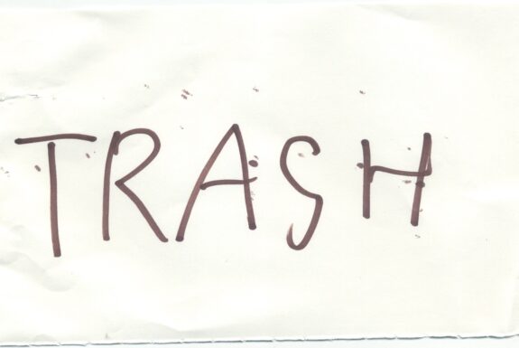 Notebook page from Step 2 with the word 'Trash' in thick black marker