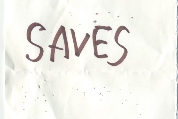 Notebook page from Step 2 with the words 'Jesus Saves' in thick black marker
