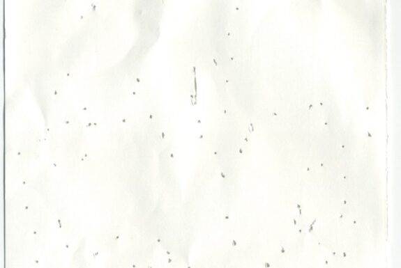 Notebook page from Step 2 with patterns of small holes made by a sewing needle