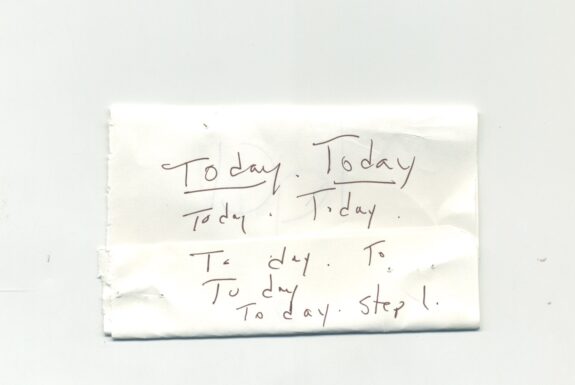 Notebook page from Step 2 with the words 'Today. Today Today Today To day To To day To day Step 1' in fine black ink