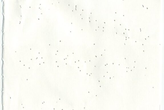 Notebook page from Step 2 with patterns of small holes made by a sewing needle