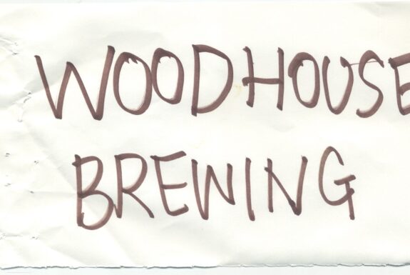 Notebook page from Step 2 with the words 'Woodhouse Brewing' in thick black marker