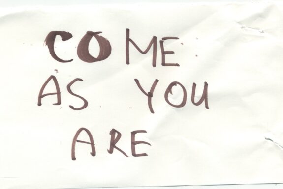 Notebook page from Step 2 with the words 'Come as you are' in thick black marker