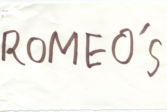 Notebook page from Step 2 with the word 'Romeo's' in thick black marker