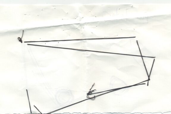 Notebook page from Step 2 (reverse side with black thread)