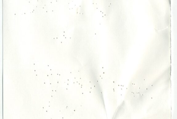 Notebook page from Step 2 with patterns of small holes made by a sewing needle