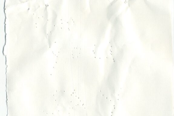 Notebook page from Step 2 with patterns of small holes made by a sewing needle