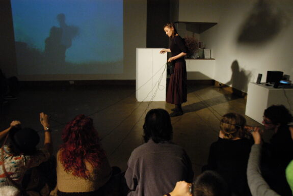 Annette Arlander performing Wind Nest – variation at XPACE Cultural Centre