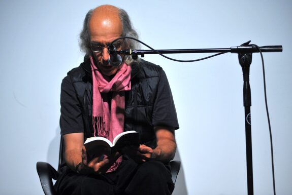 Michael Fernandes performing Doing Things with Strangers at the Toronto Free Gallery