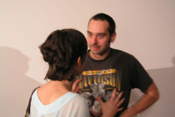 Éric Létourneau speaking with an audience member 7a*11d 2004