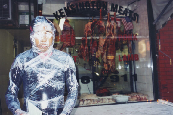 iwan Wijono performing Body for Rent / Body for Auction at Art System and surrounding areas (Chinatown, Kensington Market)