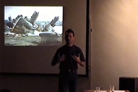 Simon Herbert delivering his lecture "Action Art in the United Kingdom" at Some Assembly Required, 7a*11d 1998