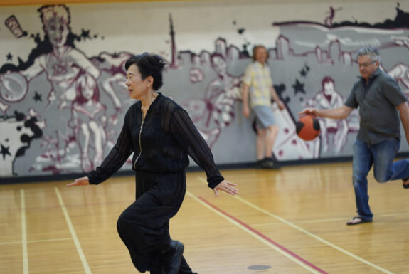 Sakiko Yamaoka and audience participant perform Body Maintenance as part of KinesTHESES, 2019
